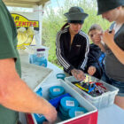 Students picking up fishing bait.