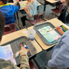 Students watercolor painting.