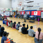 Rick Zeitlin and students in gym