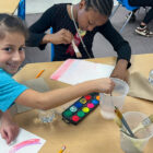 Students watercolor painting.