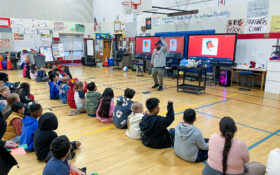 Rick Zeitlin and students in gym