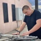 Student works on bike fabrication.