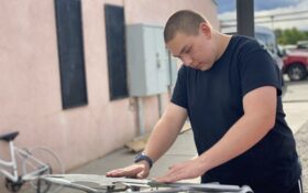 Student works on bike fabrication.