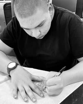 Student sketches a bike design.