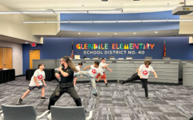 Instructor Dylan Woolley teaching students at the youth martial arts program.