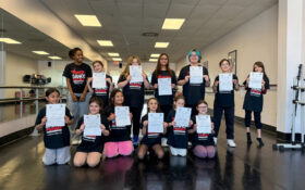 Students with their certificate of achievements.