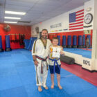 S.M. Smith with student at a Youth Martial Arts Program camp in Ohio